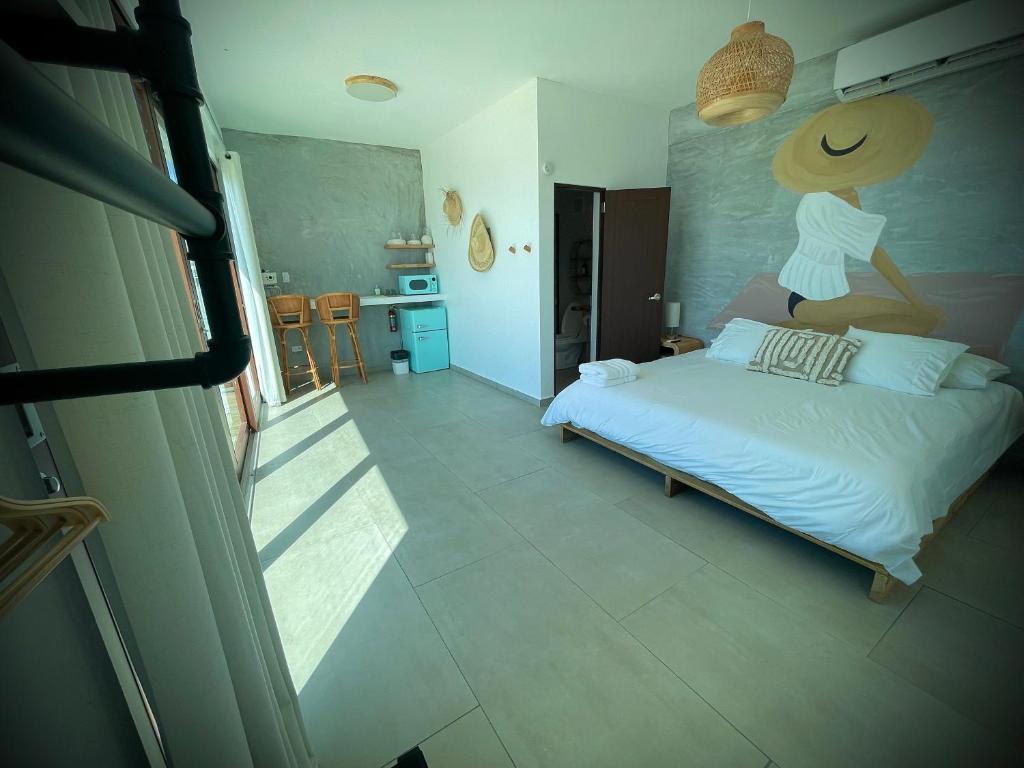 Postel nebo postele na pokoji v ubytování 1 Corcega Beachfront Suites