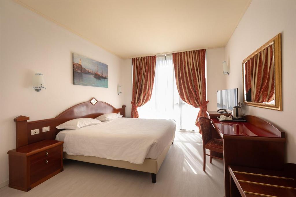 Postel nebo postele na pokoji v ubytování Noventa Hotel
