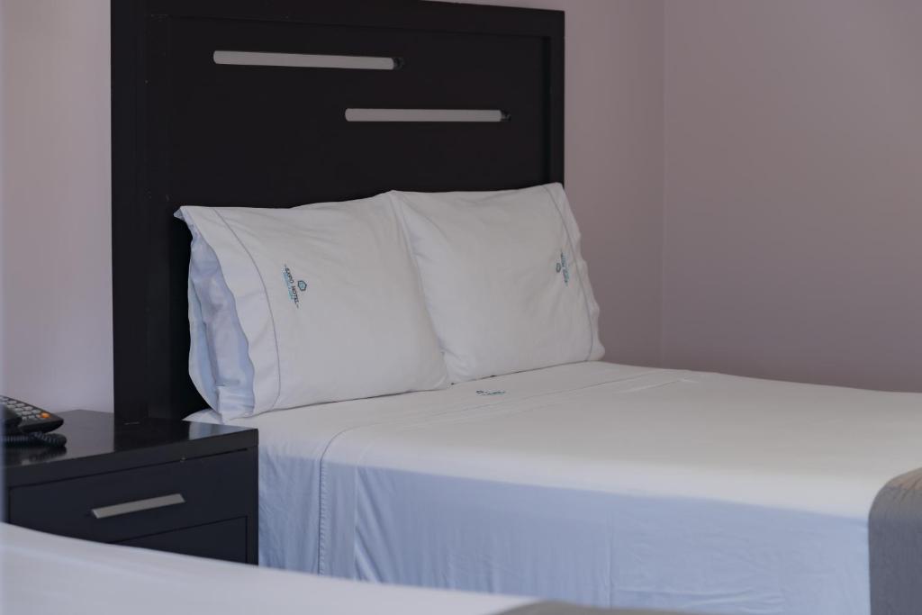 Postel nebo postele na pokoji v ubytování Expo Hotel Guadalajara - Zona Expo frente al Centro de Convenciones