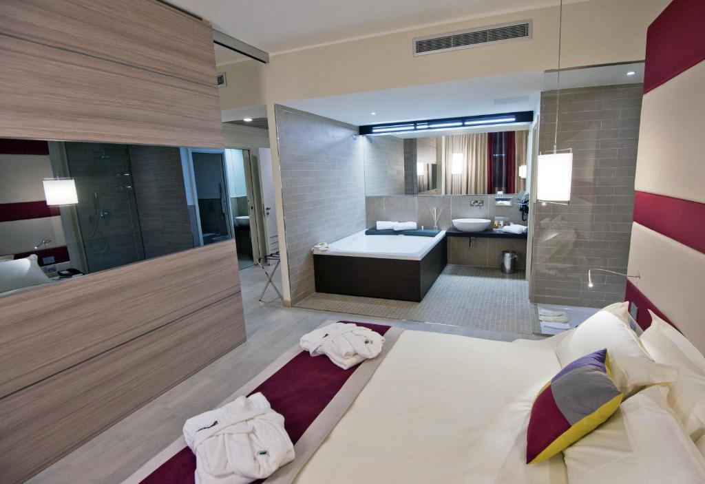 Postel nebo postele na pokoji v ubytování AS Hotel Limbiate Fiera