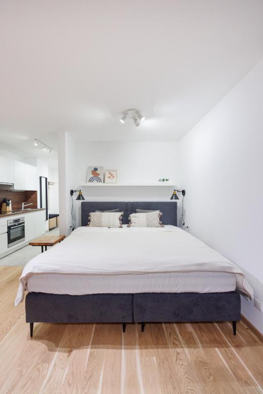 Una cama o camas en una habitación de Zoder Apartments