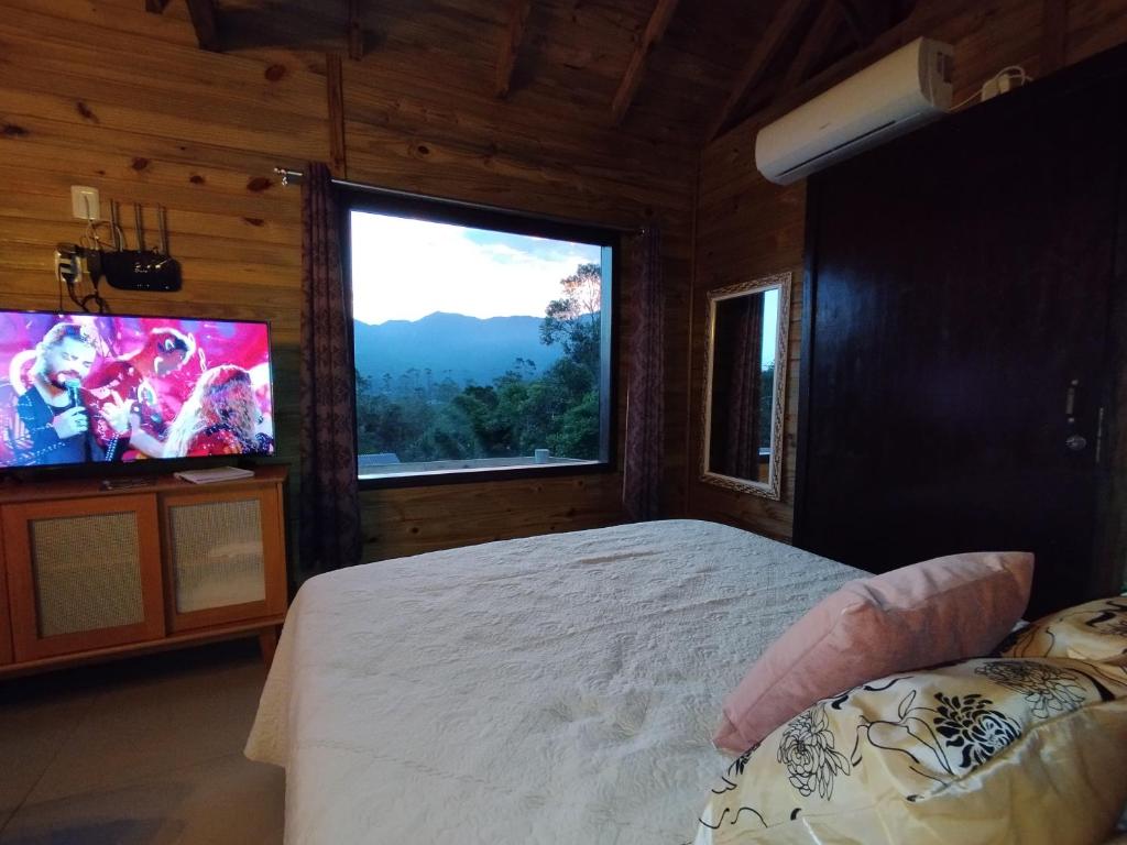 TV a/nebo společenská místnost v ubytování Tiny House Canjerana - Cabana com vista dos Canyons