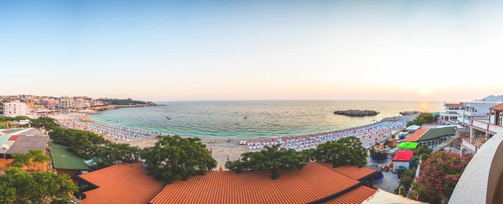 a view of a beach with a crowd of people at Apartments Deus in Dobra Voda