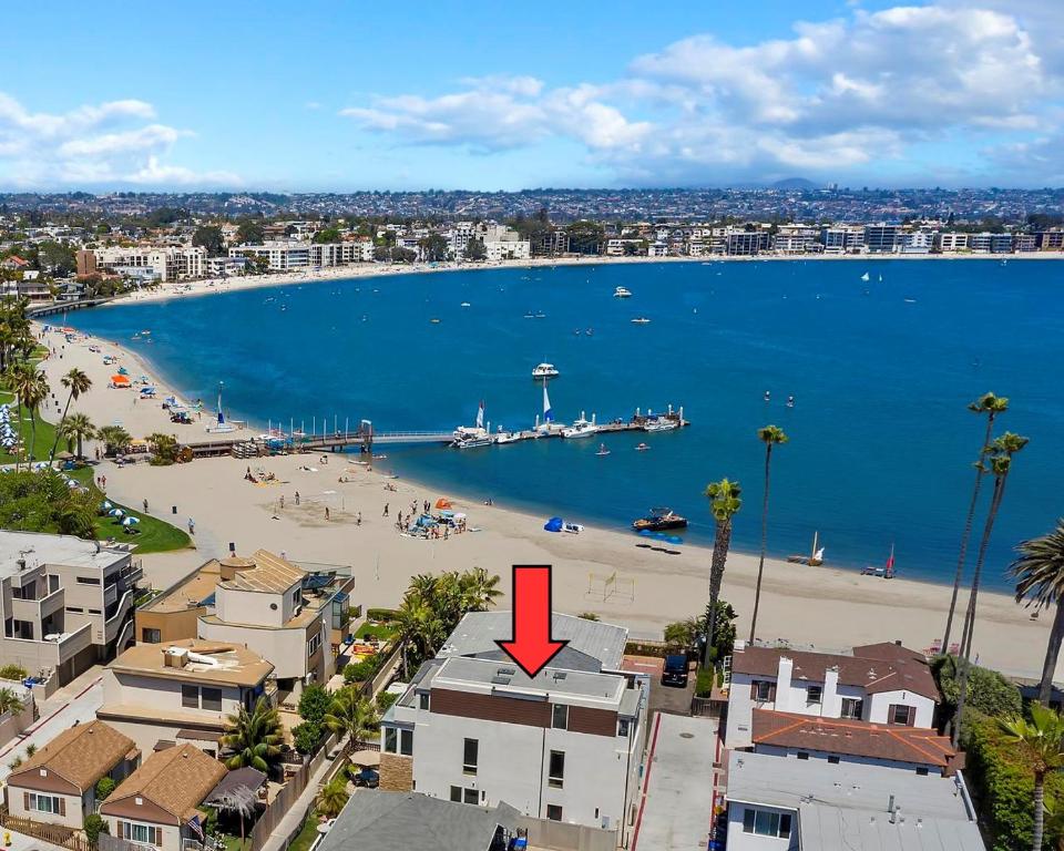 an aerial view of a beach with a red arrow at Bay View Beach House - Your Coastal Retreat in San Diego