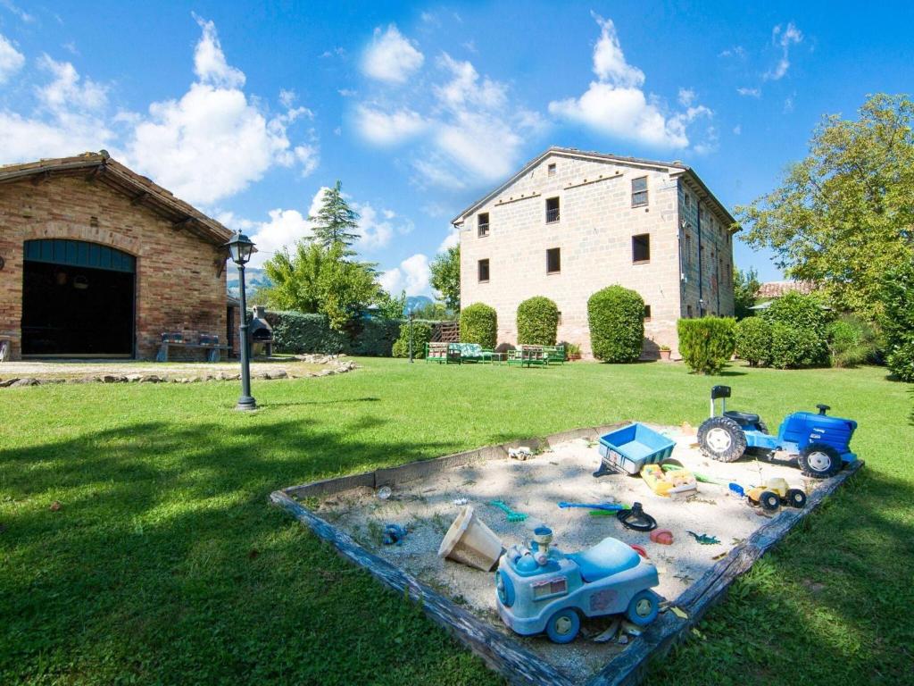 a toy train yard with toy cars and a building at Spacious Holiday Home in Amandola with Swimming Pool in Amandola