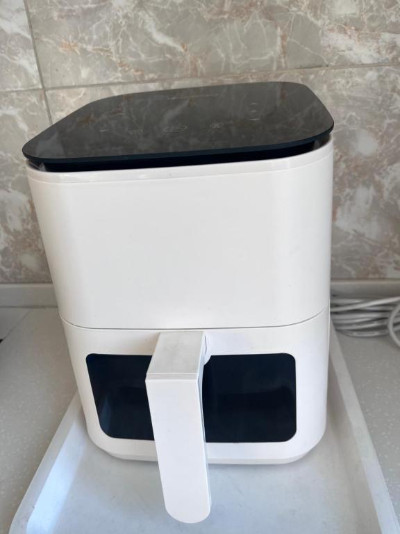 a white toaster sitting on top of a counter at VERY central location near State department store in Ulaanbaatar