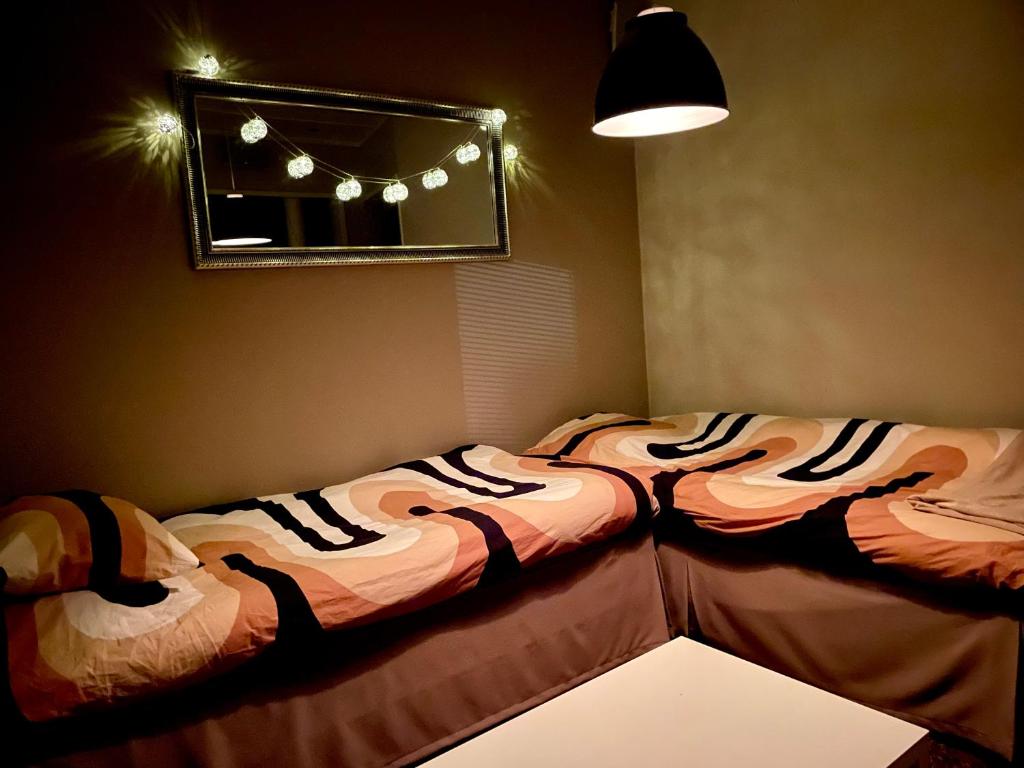 Postel nebo postele na pokoji v ubytování VuosselinHelmi 44