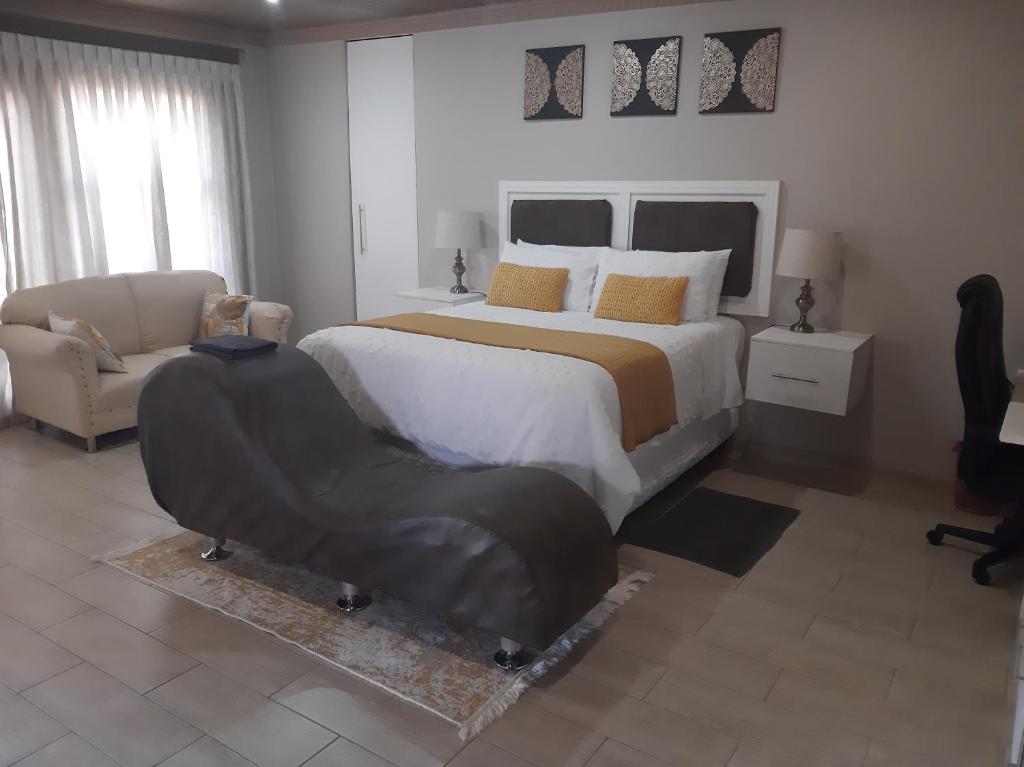 Postel nebo postele na pokoji v ubytování Bonfai Residence