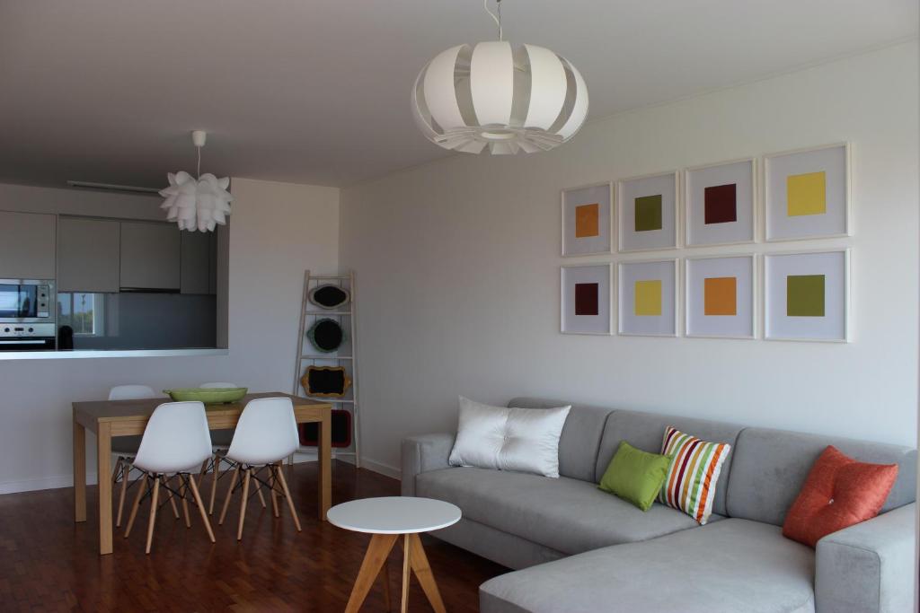 a living room with a couch and a table at Mel Apartment in Funchal