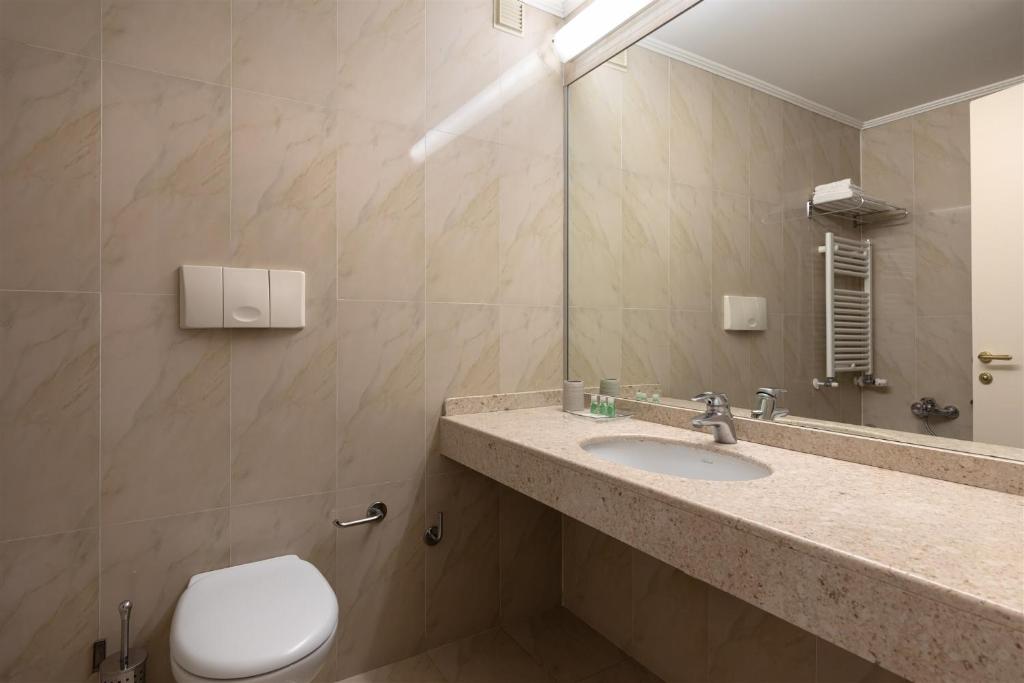 Koupelna v ubytování Noventa Hotel