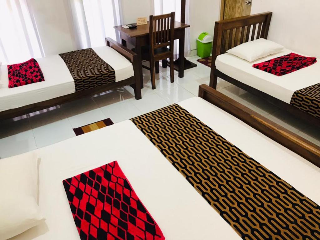 Postel nebo postele na pokoji v ubytování Anuradhapura Kanimadala Resort