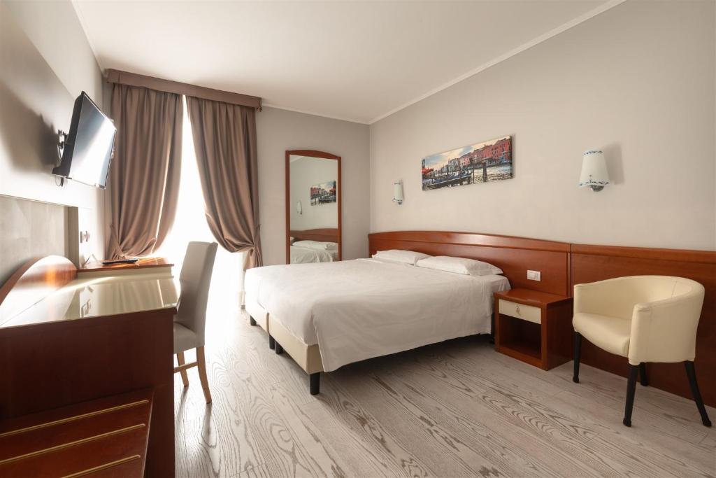 Postel nebo postele na pokoji v ubytování Noventa Hotel