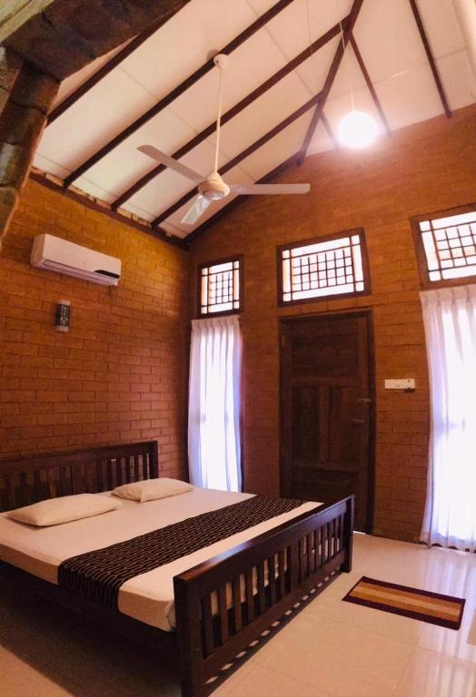 Postel nebo postele na pokoji v ubytování Anuradhapura Kanimadala Resort