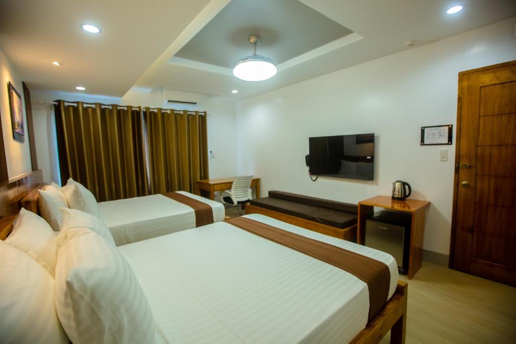 TV a/nebo společenská místnost v ubytování Horizon Hotel Romblon