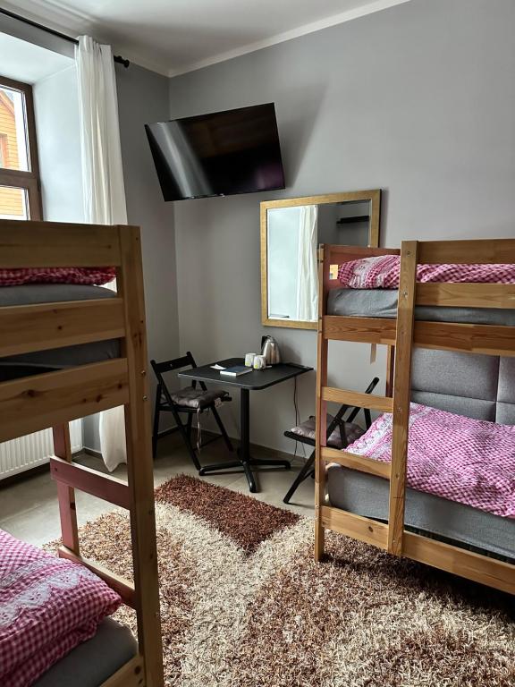 Postel nebo postele na pokoji v ubytování Penzion Apidae