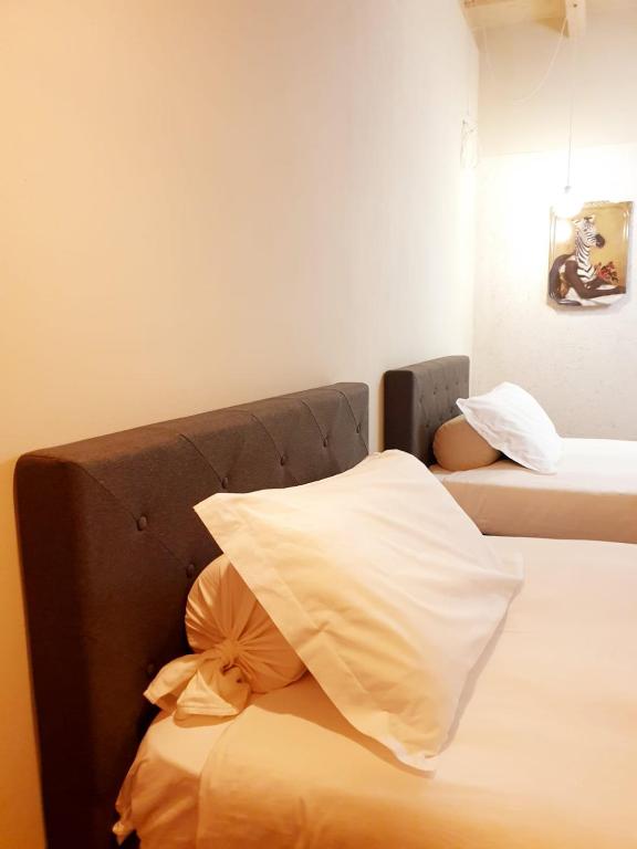 Postel nebo postele na pokoji v ubytování Hotel Aracoeli