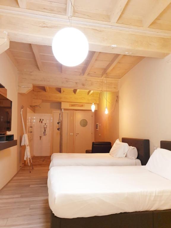 Postel nebo postele na pokoji v ubytování Hotel Aracoeli