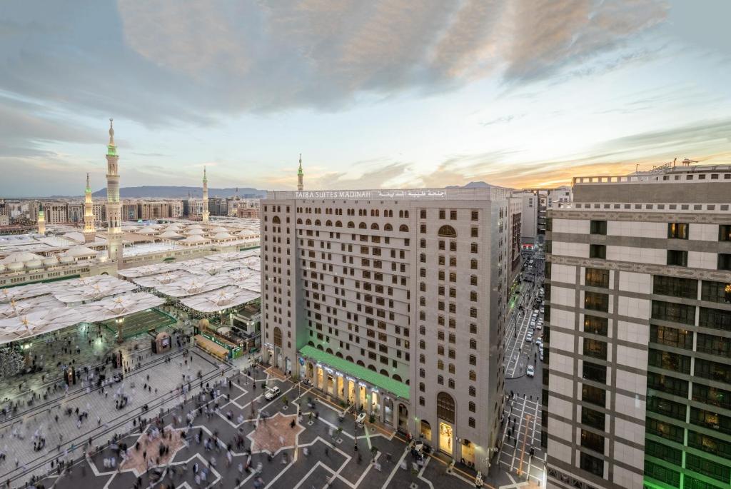 an overhead view of a city with tall buildings at Taiba Suites Madinah in Medina