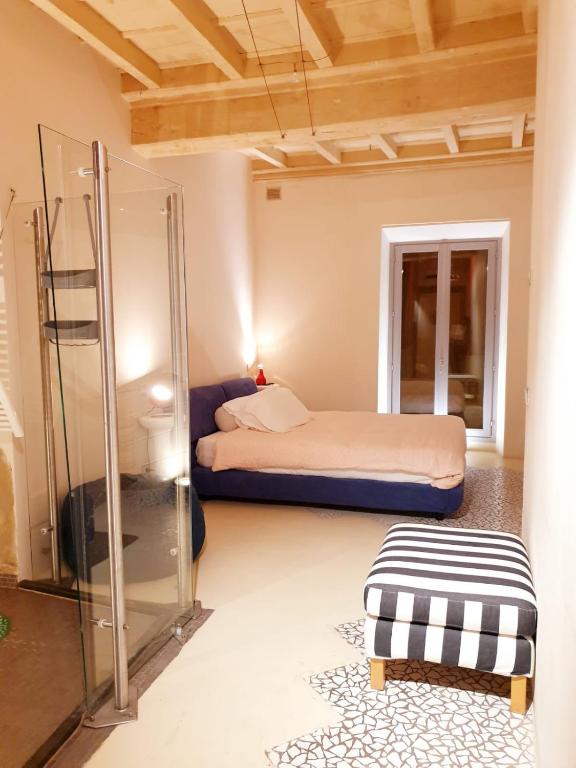 Postel nebo postele na pokoji v ubytování Hotel Aracoeli