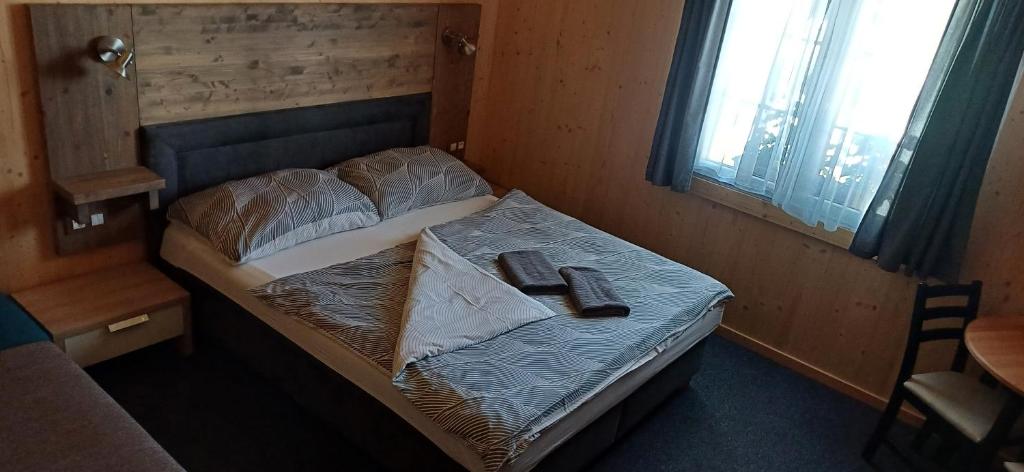 Postel nebo postele na pokoji v ubytování PENZION PARMA
