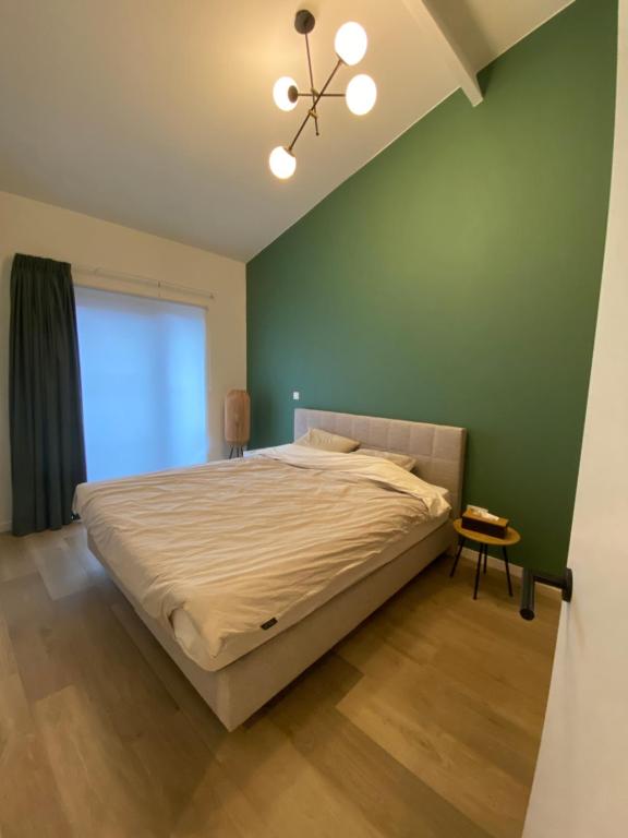 Tempat tidur dalam kamar di Luxury & cozy apartment