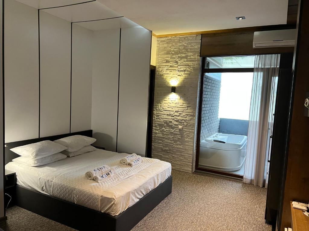 Postel nebo postele na pokoji v ubytování KENT hotel & Restaurant KENT beach