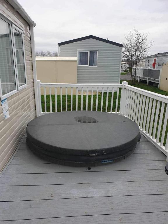 a trampoline sitting on top of a deck at hot tub luxury caravan 23 Lancaster tattershall lakes in Tattershall