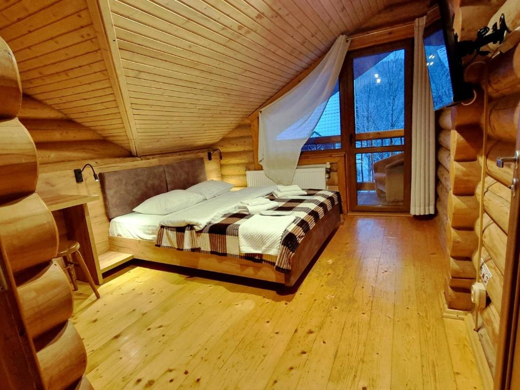 Cama ou camas em um quarto em Hotel Bereg