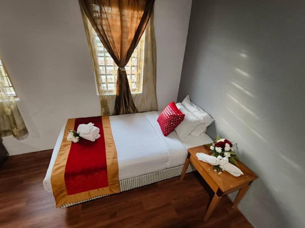 Postel nebo postele na pokoji v ubytování 1 Hati Homestay Sepang