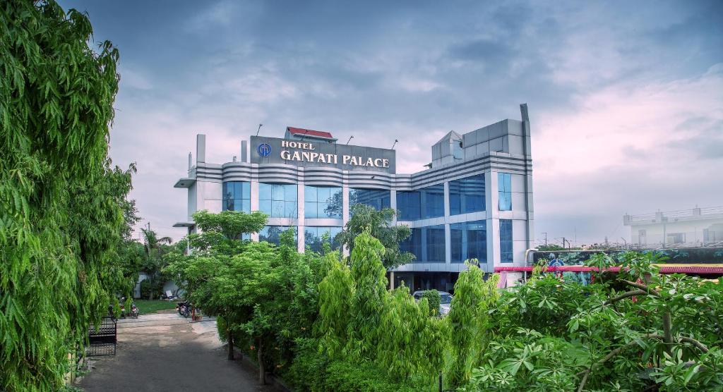 a building with a sign that reads hotel carril palace at Hotel Ganpati Palace in Mathura