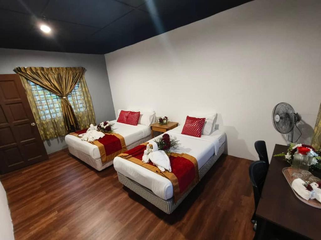 Postel nebo postele na pokoji v ubytování 1 Hati Homestay Sepang
