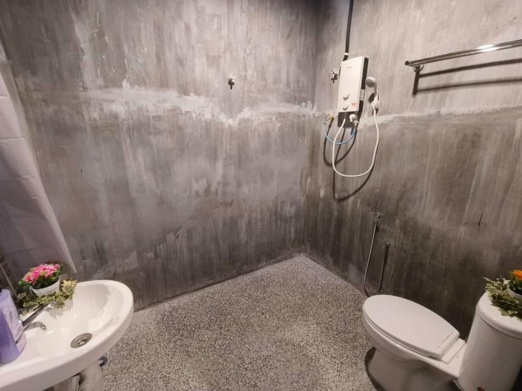 Koupelna v ubytování 1 Hati Homestay Sepang