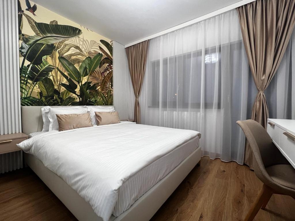 Un pat sau paturi într-o cameră la Florilor Residence I
