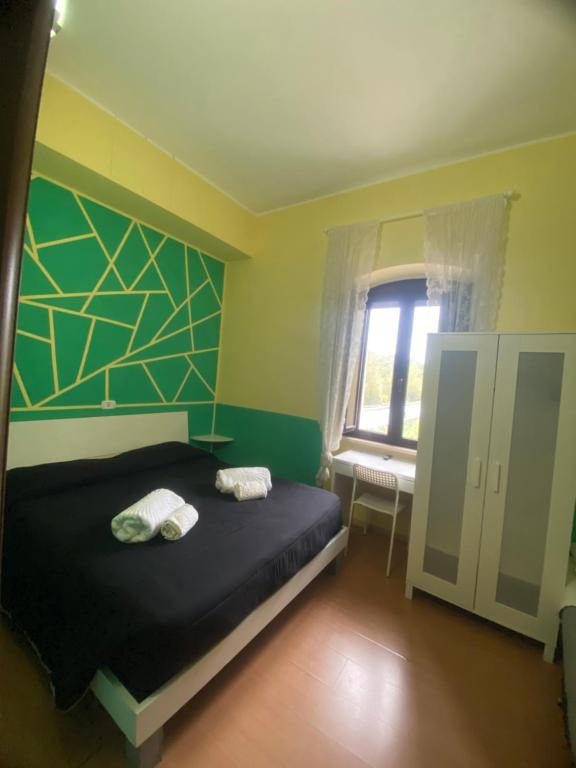Posteľ alebo postele v izbe v ubytovaní La Foresteria