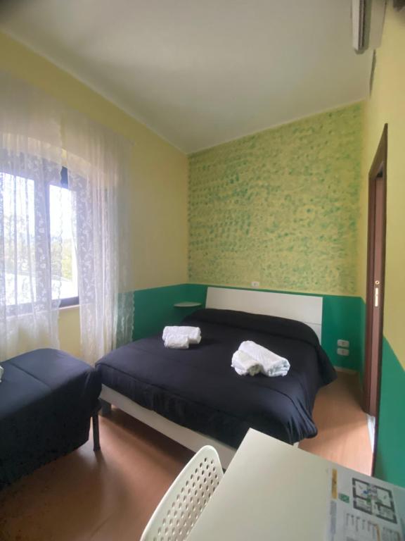 Posteľ alebo postele v izbe v ubytovaní La Foresteria