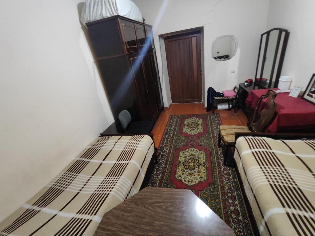 Postel nebo postele na pokoji v ubytování Guest House FloraS
