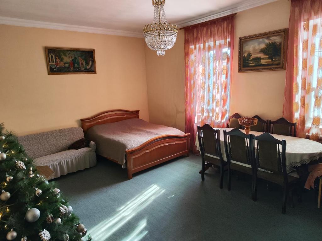 Postel nebo postele na pokoji v ubytování Guest House FloraS