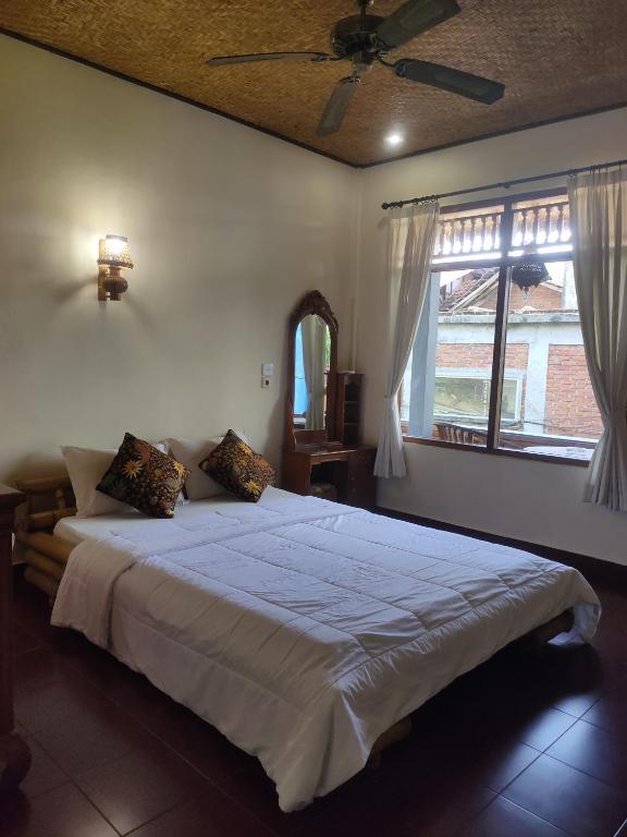 Postel nebo postele na pokoji v ubytování Candra Asri Bungalow