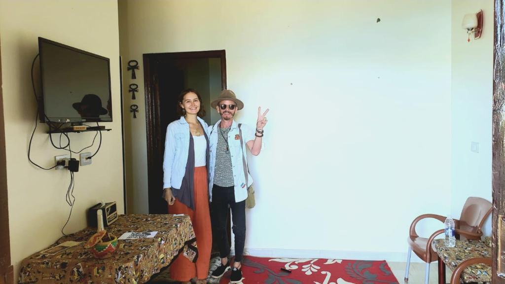 a man and a woman standing in a room at Mooody nobin haws in Abu Simbel