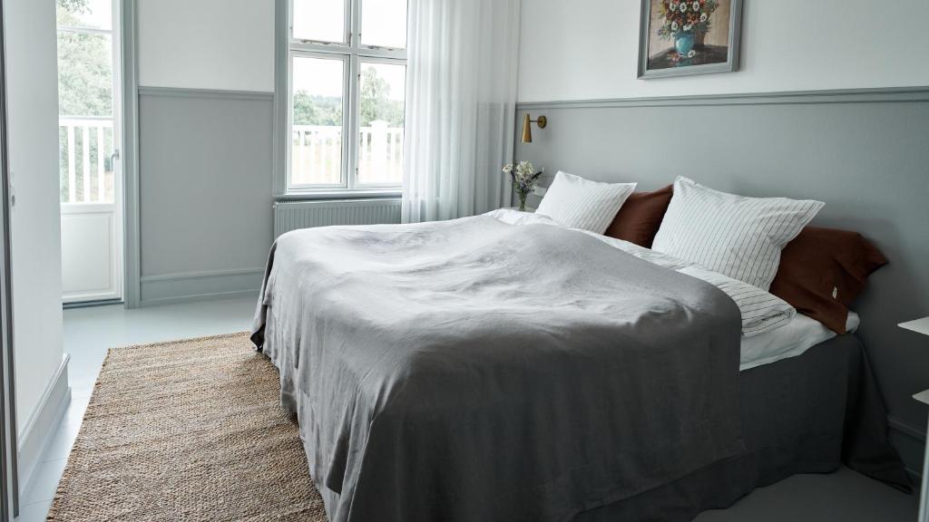 Postel nebo postele na pokoji v ubytování Hotel Ny Hattenæs