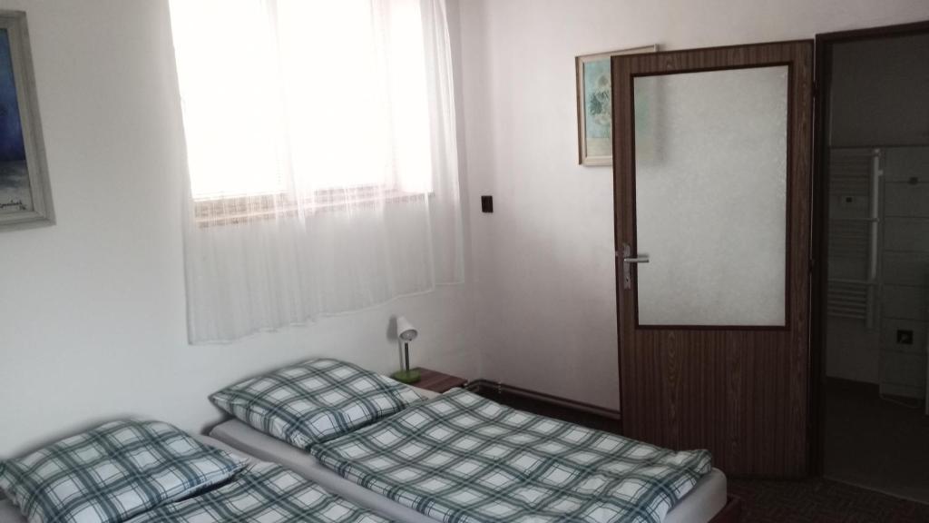 Postel nebo postele na pokoji v ubytování Apartmány u Martina
