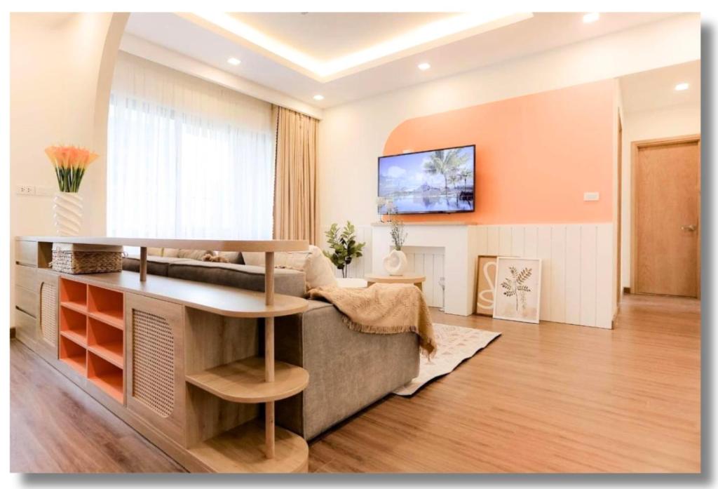 a living room with a couch and a table at FLC Luxury Apartment Quy Nhon in Quy Nhon