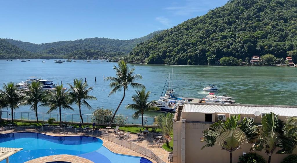 a view of a body of water with boats in it at Loft 326 - APTO E VISTA ESPETACULARES in Mangaratiba