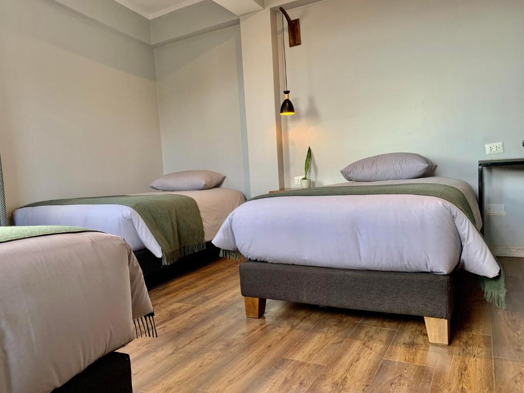 Postel nebo postele na pokoji v ubytování Casa Encuentro San Blas