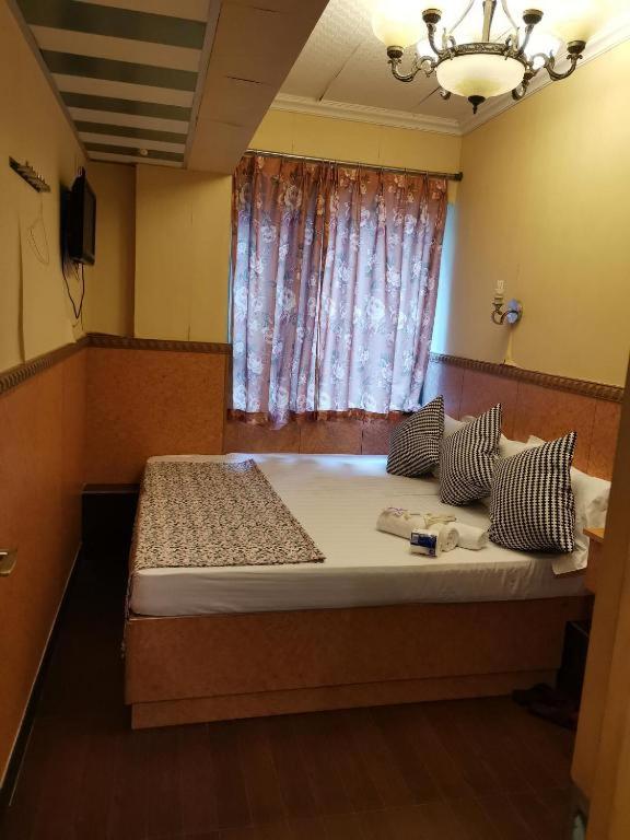 Postel nebo postele na pokoji v ubytování Prime Star Inn
