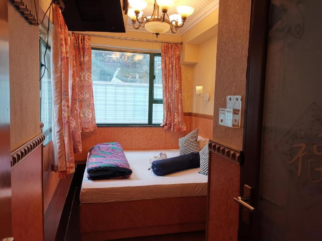 Postel nebo postele na pokoji v ubytování Prime Star Inn