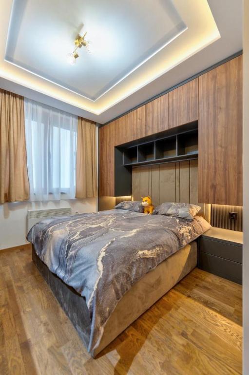 Postel nebo postele na pokoji v ubytování Mans lux 8 Apartman