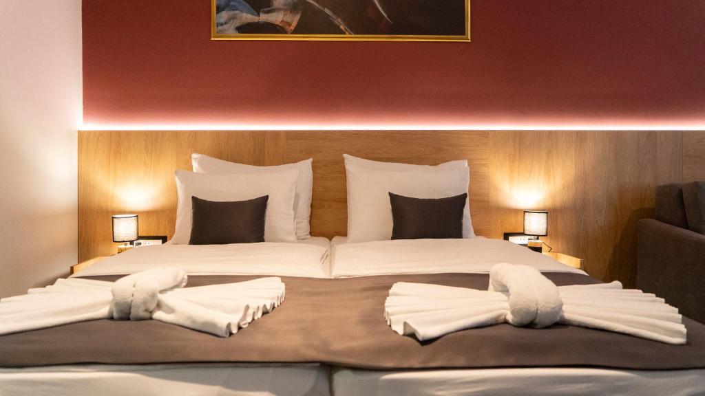 Postel nebo postele na pokoji v ubytování HA Hotel Mostar