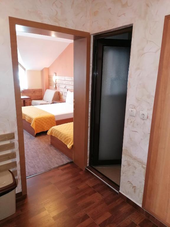 Postel nebo postele na pokoji v ubytování Boutique Guest House IKONOMOV