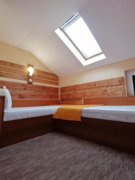 Postel nebo postele na pokoji v ubytování Boutique Guest House IKONOMOV